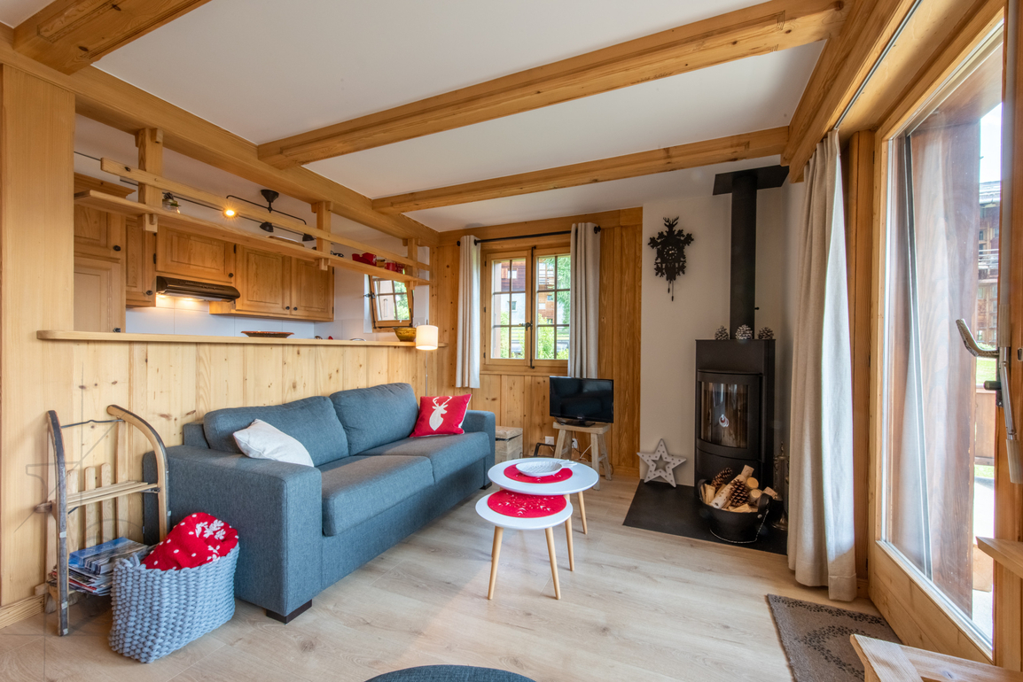 appartement-verseau-17-verbier-salon-canape-poele-02.jpg