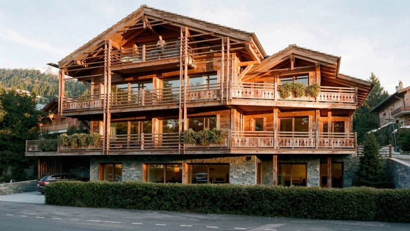 Façade extérieure enneigée au crépuscule – Appartement Gentianes Duplex Combles - Verbier