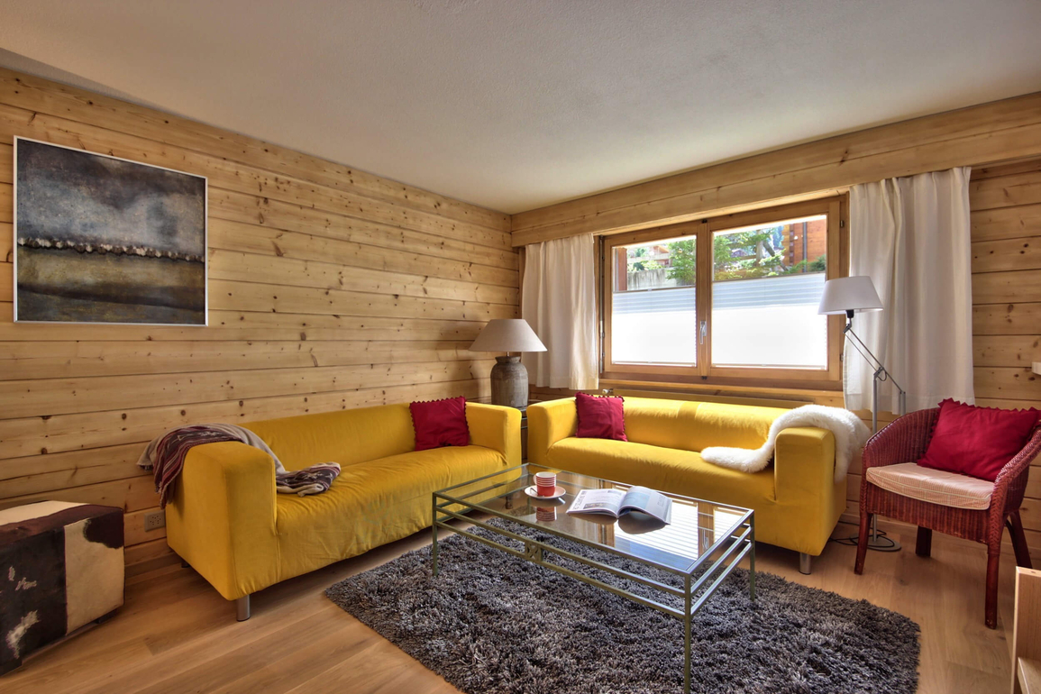 appartement-flaminia-012-verbier-salon-cosy-01.jpg